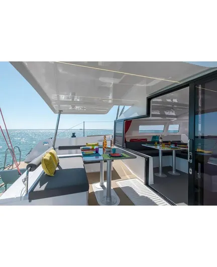 Kaya Yacht Photos Pics Spacious deck of 2021 Neel 43 trimaran with dining area and ocean view.