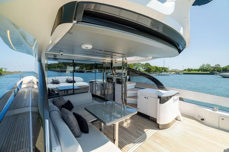 Second Chances Yacht Photos Pics Luxurious 2024 Azimut S7 yacht with elegant outdoor seating and scenic water views.
