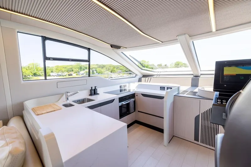 Second Chances Yacht Photos Pics Luxurious interior of 2024 Azimut S7 yacht with modern kitchen design.