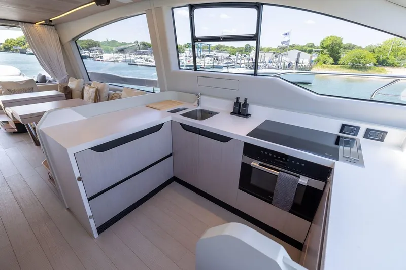Second Chances Yacht Photos Pics Modern kitchen interior on 2024 Azimut S7 yacht, featuring sleek design and waterfront view.