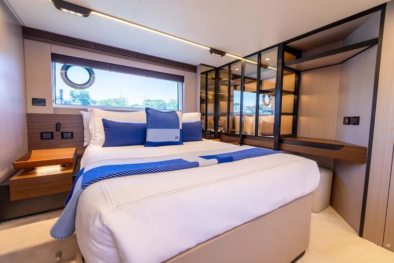 Second Chances Yacht Photos Pics Luxurious bedroom interior of 2024 Azimut S7 yacht with modern design and elegant furnishings.
