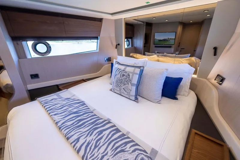 Second Chances Yacht Photos Pics Luxurious bedroom interior of 2024 Azimut S7 yacht with elegant bedding and modern design.