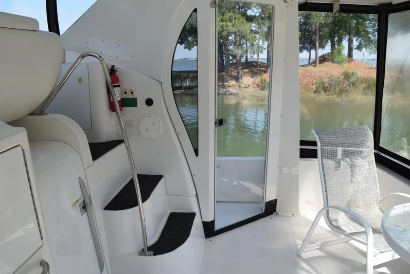 King George V Yacht Photos Pics Interior view of 2002 Carver 444 Cockpit Motoryacht with steps and seating area.