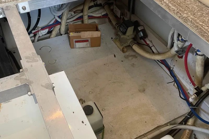 King George V Yacht Photos Pics Engine compartment of a 2002 Carver 444 Cockpit Motoryacht with various hoses and equipment.