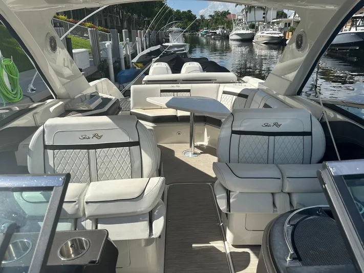 Sales Therapy Yacht Photos Pics Luxurious 2018 Sea Ray 310 SLX boat interior with elegant seating and canal view.