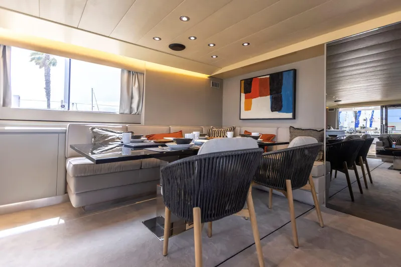  Yacht Photos Pics Luxurious dining area on 1987 Versilcraft FALCON 82 yacht, featuring modern decor and elegant seating.