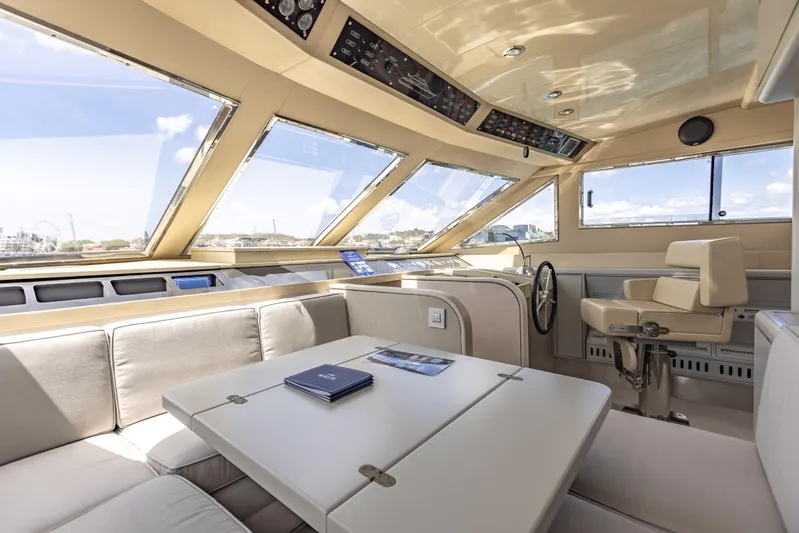  Yacht Photos Pics Interior of 1987 Versilcraft FALCON 82 yacht, featuring spacious seating and helm.