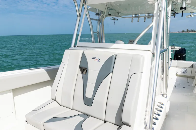  Yacht Photos Pics 2015 SeaVee 390Z boat interior with cushioned seating, ocean backdrop.