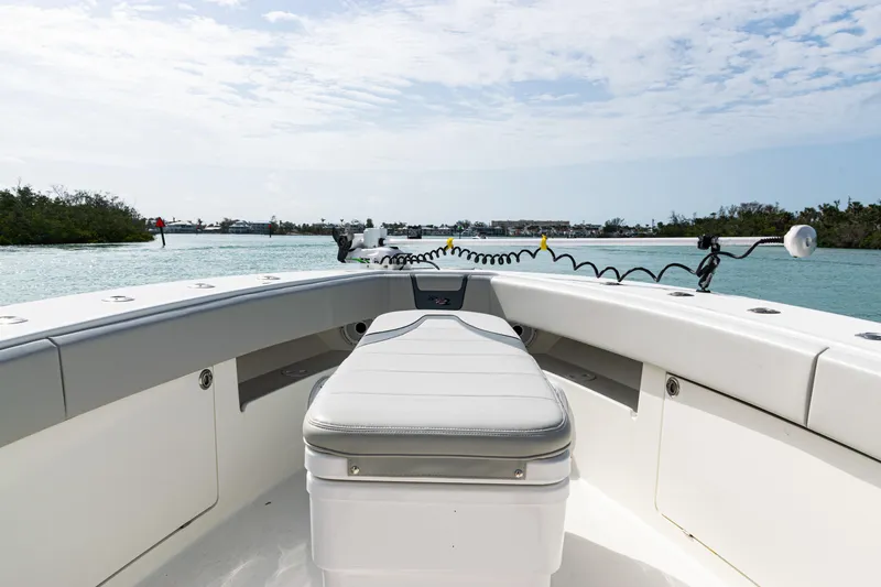  Yacht Photos Pics 2015 SeaVee 390Z boat interior with seating, navigating calm waters under a partly cloudy sky.