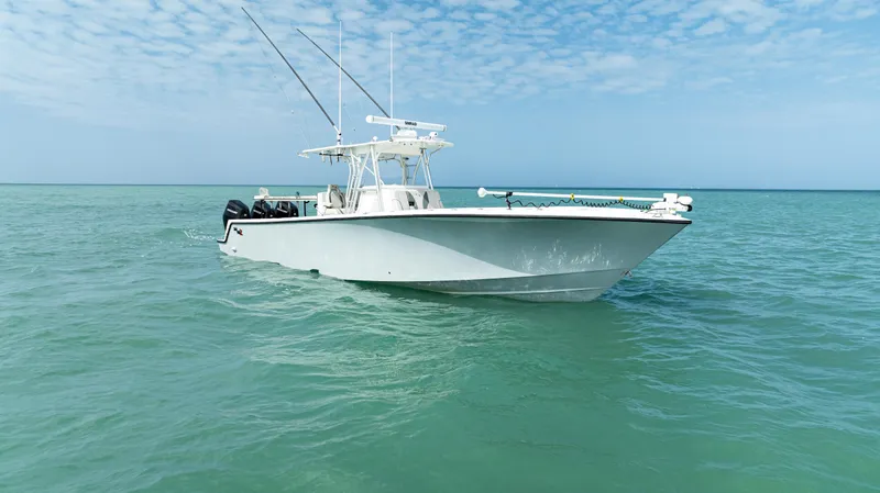  Yacht Photos Pics 2015 SeaVee 390Z boat on calm ocean waters under a partly cloudy sky.