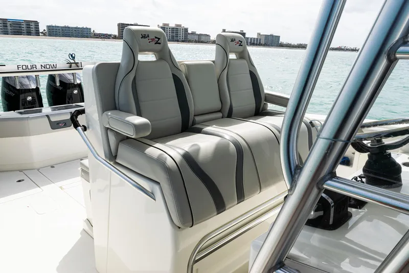  Yacht Photos Pics 2015 SeaVee 390Z boat interior with dual gray seats, ocean view in background.