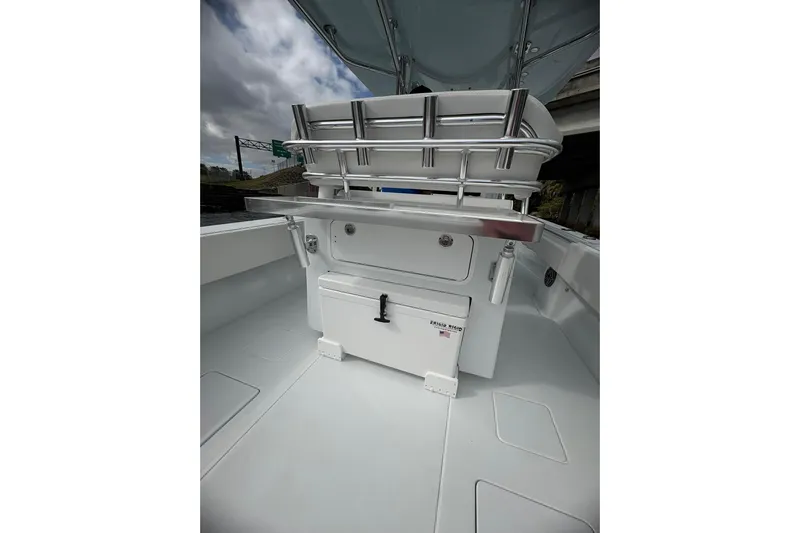  Yacht Photos Pics 2025 Contender 32 ST boat interior with storage compartments and seating.