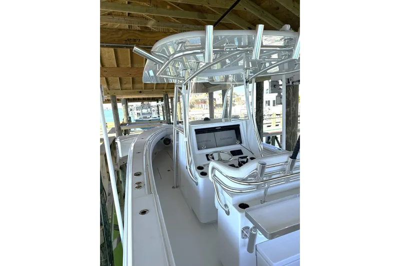  Yacht Photos Pics 2025 Contender 32 ST boat interior with modern helm and sleek design.