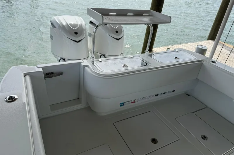  Yacht Photos Pics 2025 Contender 32 ST boat with dual outboard motors and spacious deck layout.