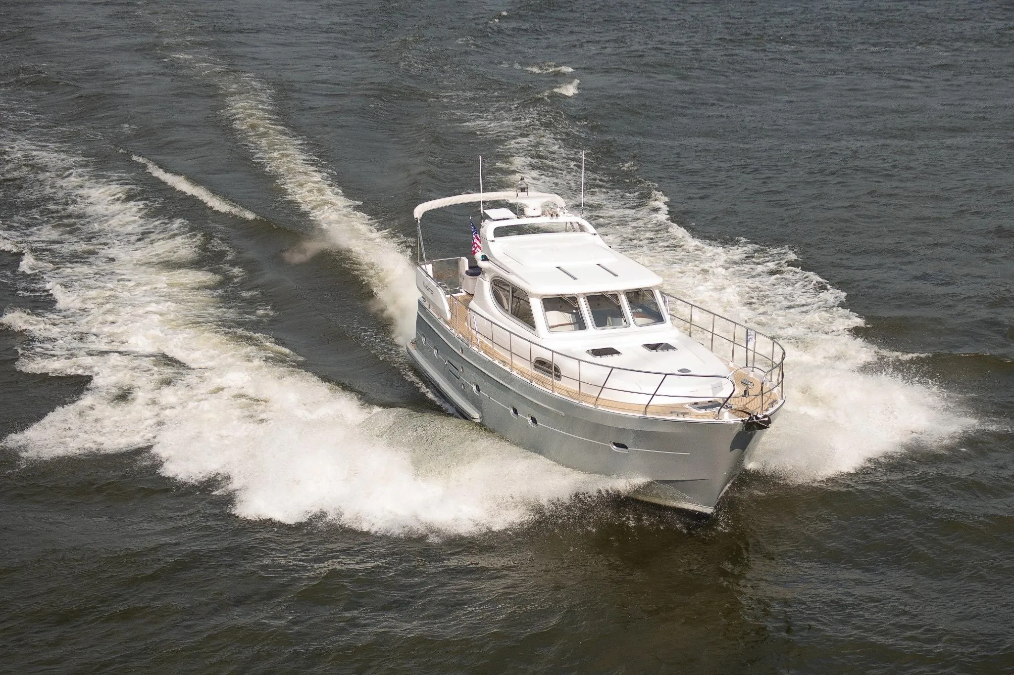 Elling E4 2026 yacht cruising on open water, creating a dynamic wake.