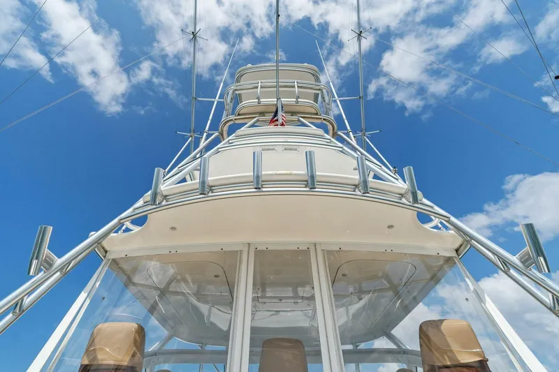 Mahirita Yacht Photos Pics 2014 Viking 42 Open yacht tower against blue sky with clouds.
