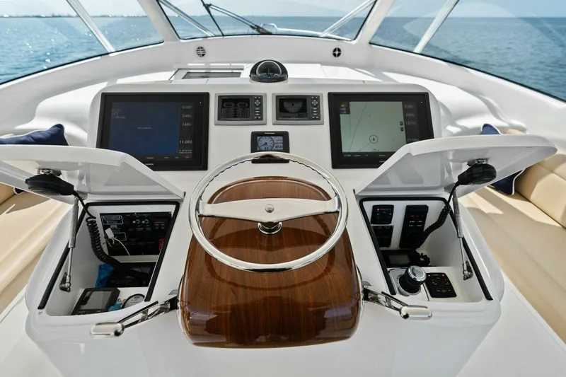 Mahirita Yacht Photos Pics Cockpit of a 2014 Viking 42 Open yacht with advanced navigation systems.