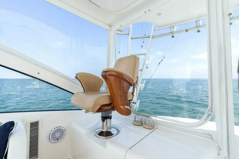 Mahirita Yacht Photos Pics Captain's chair on a 2014 Viking 42 Open yacht with ocean view.