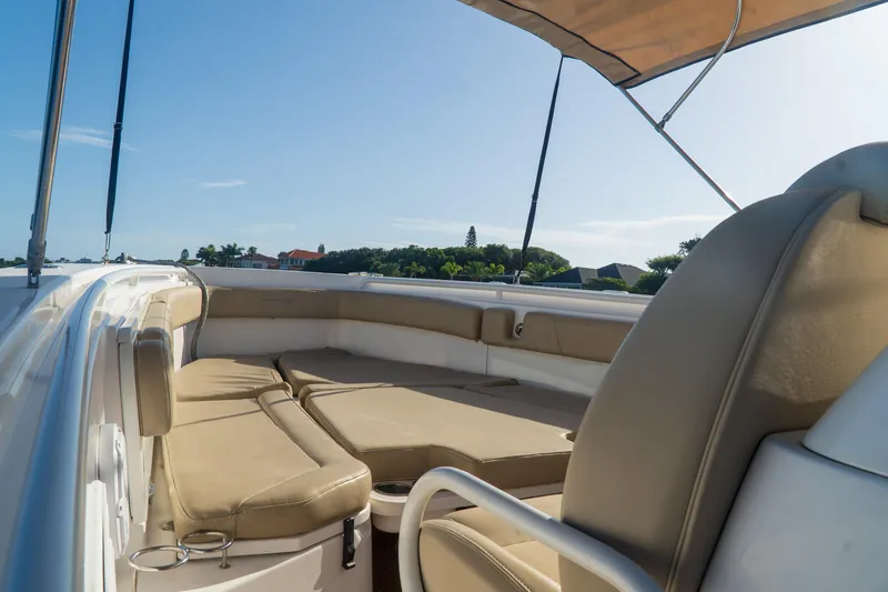 Love Me Tender Yacht Photos Pics 2019 Everglades 355 Center Console boat with spacious seating and sunshade.