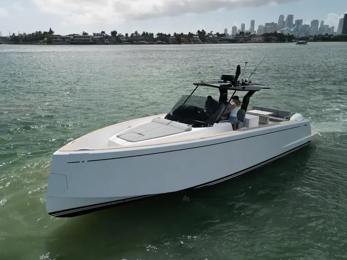 M/y Big Day Yacht Photos Pics 2022 Pardo Yachts 38 cruising in clear waters near a city skyline.