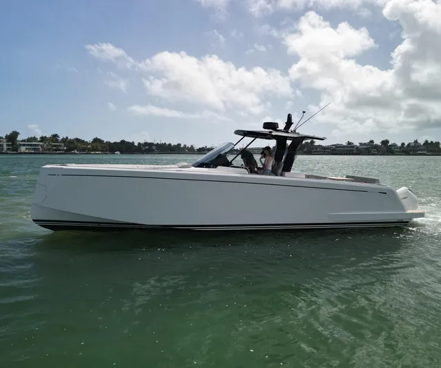 M/y Big Day Yacht Photos Pics 2022 Pardo Yachts 38 cruising on calm waters under a partly cloudy sky.