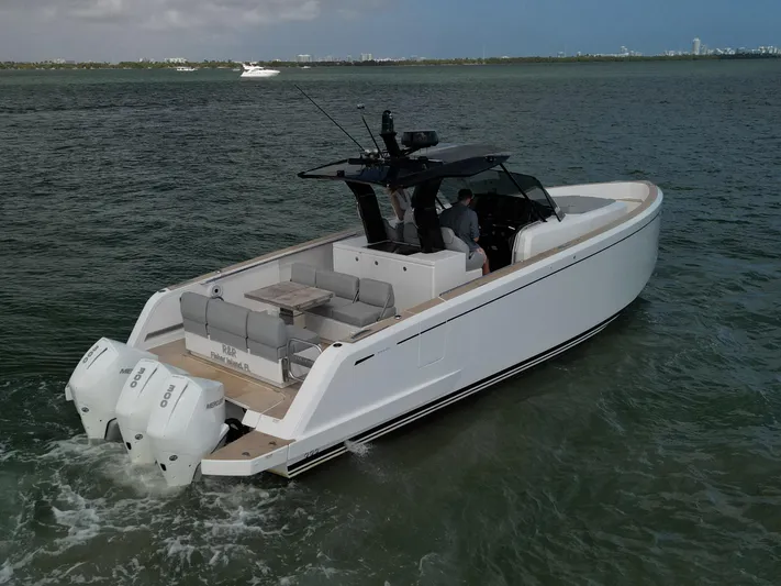 M/y Big Day Yacht Photos Pics 2022 Pardo Yachts 38 cruising on open water, featuring sleek design and twin outboard engines.