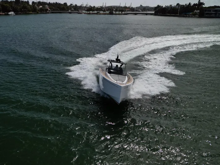 M/y Big Day Yacht Photos Pics 2022 Pardo Yachts 38 cruising on open water, creating a dynamic wake.