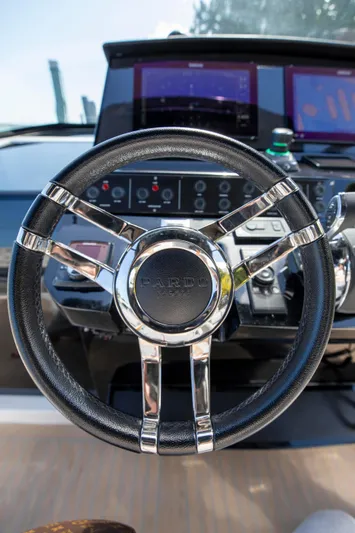 M/y Big Day Yacht Photos Pics Steering wheel of 2022 Pardo Yachts 38, featuring modern dashboard controls.