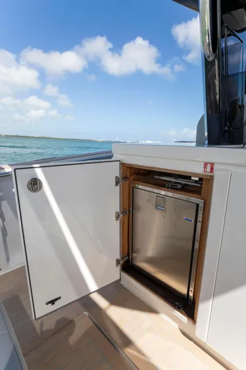 M/y Big Day Yacht Photos Pics Pardo Yachts 38 (2022) with open storage compartment, ocean view, and clear sky.