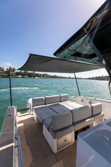 M/y Big Day Yacht Photos Pics 2022 Pardo Yachts 38 with sunshade, luxurious seating, and scenic ocean view.