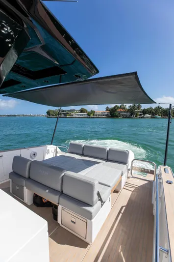 M/y Big Day Yacht Photos Pics 2022 Pardo Yachts 38 cruising on blue water, featuring spacious deck and sunshade.