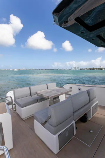 M/y Big Day Yacht Photos Pics 2022 Pardo Yachts 38 with elegant seating, ocean view, and clear blue sky.