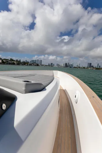 M/y Big Day Yacht Photos Pics 2022 Pardo Yachts 38 cruising on water with city skyline in background.