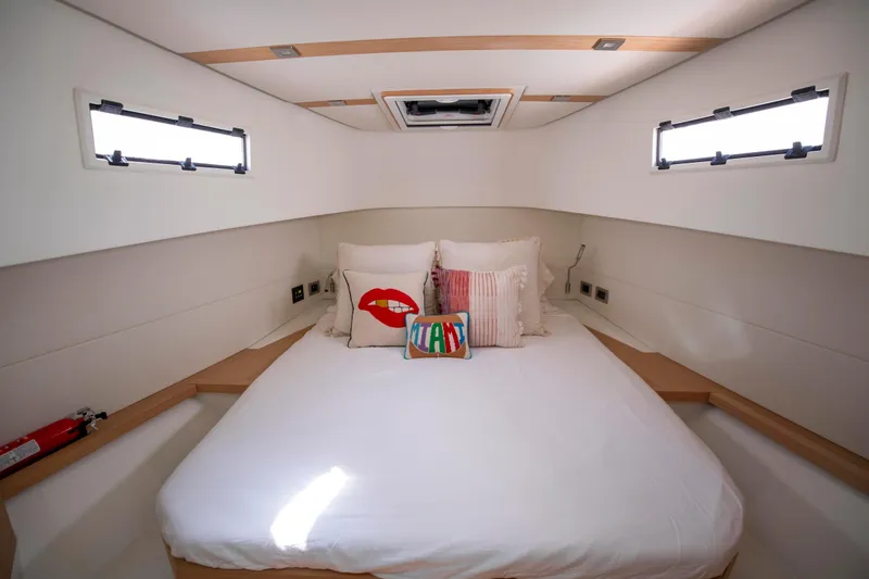 M/y Big Day Yacht Photos Pics Luxurious cabin interior of 2022 Pardo Yachts 38, featuring a cozy bed and stylish decor.