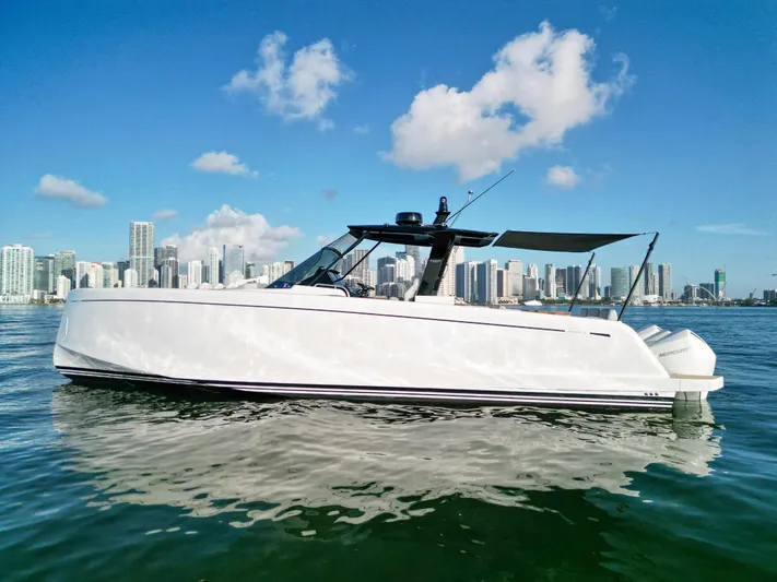 M/y Big Day Yacht Photos Pics 2022 Pardo Yachts 38 cruising on water with city skyline backdrop.