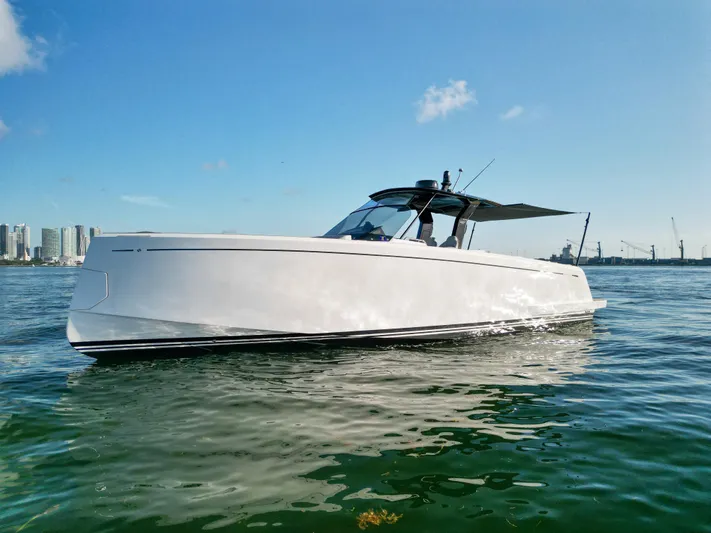 M/y Big Day Yacht Photos Pics 2022 Pardo Yachts 38 cruising on calm waters under a clear blue sky.