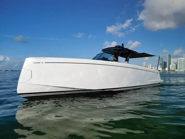 M/y Big Day Yacht Photos Pics 2022 Pardo Yachts 38 cruising on calm waters with city skyline in background.