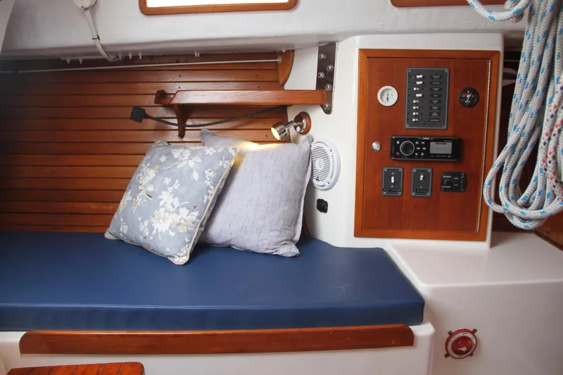 Easterly Yacht Photos Pics Interior of 2009 e Sailing Yachts e33 with cushions and control panel.