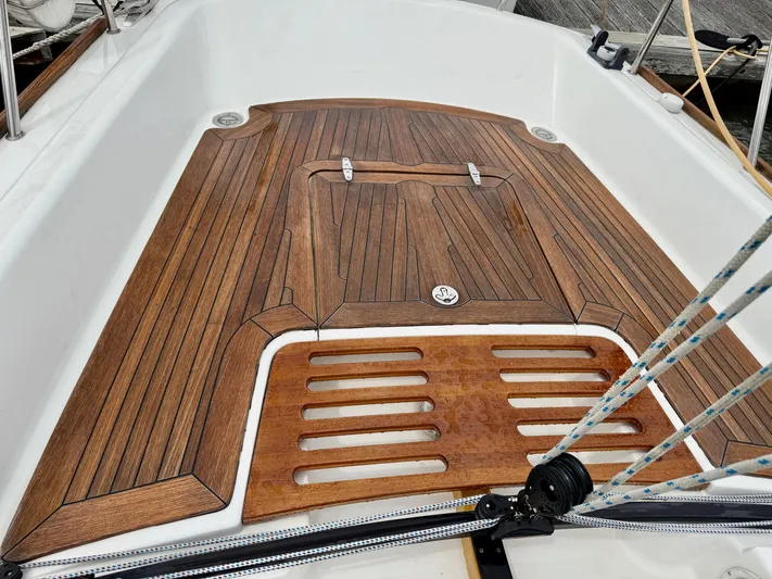 Easterly Yacht Photos Pics Teak deck of 2009 e Sailing Yachts e33, featuring elegant wood finish and rope details.