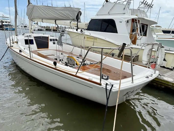 Easterly Yacht Photos Pics 2009 e Sailing Yachts e33 docked at marina, featuring sleek design and wooden deck.