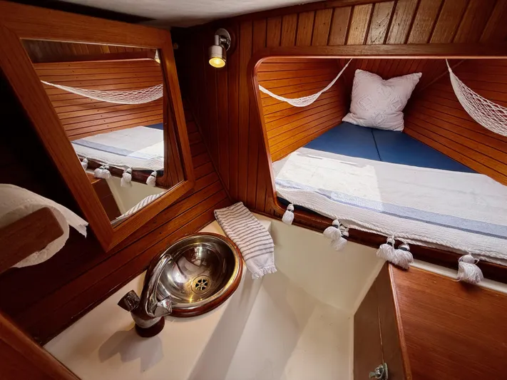 Easterly Yacht Photos Pics Cozy cabin interior of 2009 e Sailing Yachts e33 with wooden finish and compact sink.