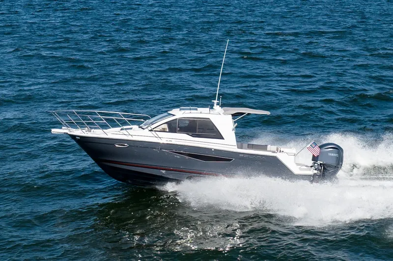  Yacht Photos Pics Manufacturer Provided Image: 2024 Solara S-250 Coupe boat cruising on open water.