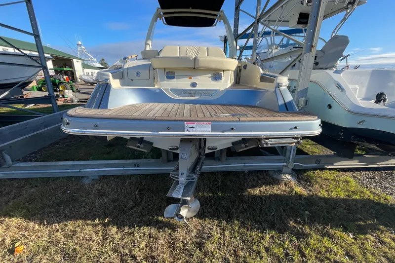  Yacht Photos Pics 2020 Chris-Craft Launch 28 GT boat on trailer, rear view with propeller and swim platform.