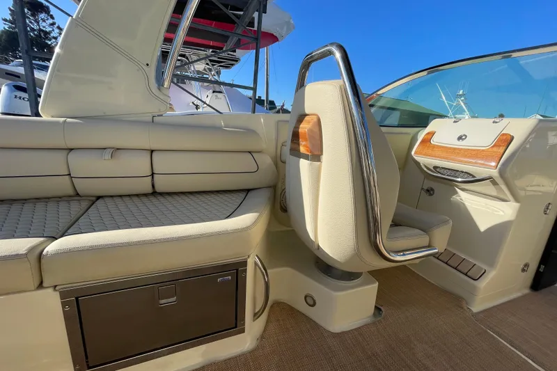  Yacht Photos Pics 2020 Chris-Craft Launch 28 GT interior with beige seating and wood accents.