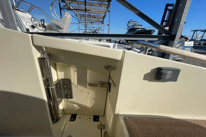  Yacht Photos Pics 2020 Chris-Craft Launch 28 GT interior detail with seating and control panel.