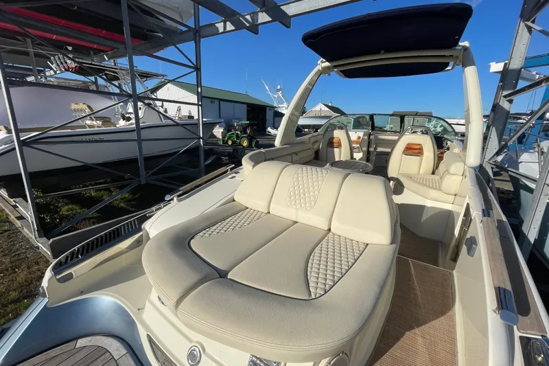  Yacht Photos Pics 2020 Chris-Craft Launch 28 GT boat with luxurious seating in a marina setting.