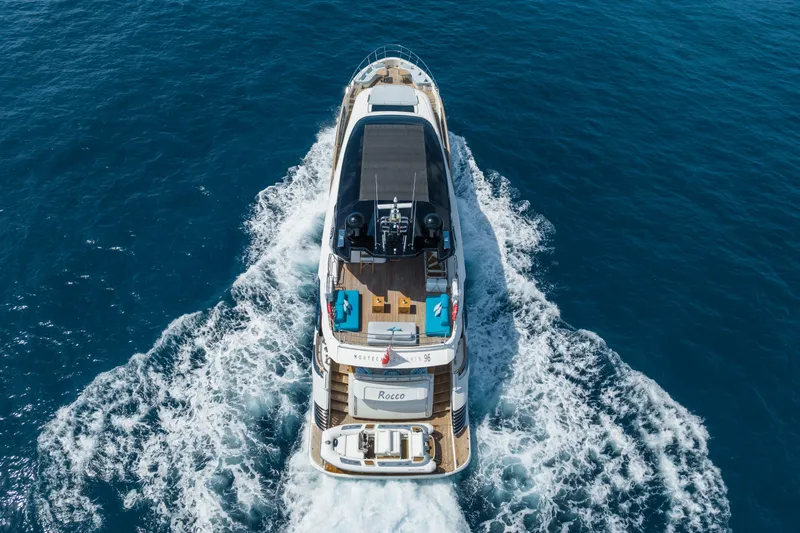Rocco Yacht Photos Pics Aerial view of 2021 Monte Carlo Yachts MCY 96 cruising on the ocean.