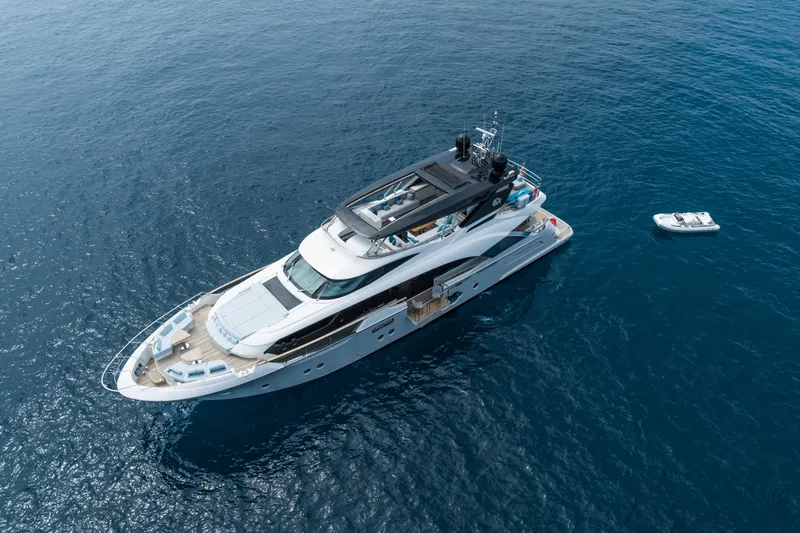 Rocco Yacht Photos Pics Aerial view of 2021 Monte Carlo Yachts MCY 96 luxury yacht on open water.