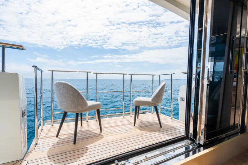 Rocco Yacht Photos Pics Luxury deck view on 2021 Monte Carlo Yachts MCY 96, featuring ocean and sky.