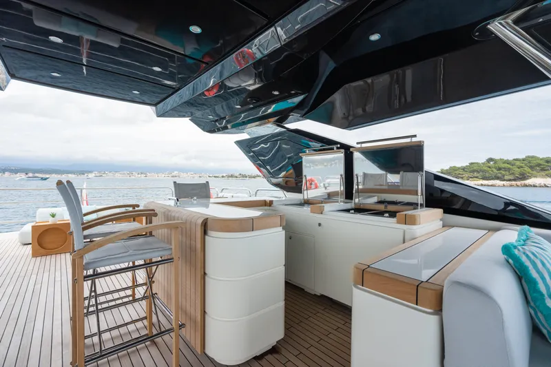 Rocco Yacht Photos Pics Luxurious deck of 2021 Monte Carlo Yachts MCY 96 with modern seating and ocean view.